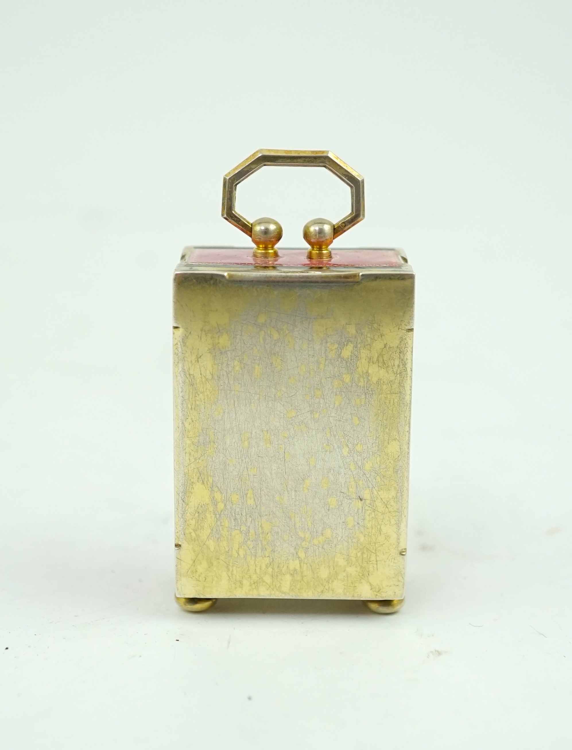 An early 20th century Swiss silver gilt and two colour enamel miniature carriage timepiece
